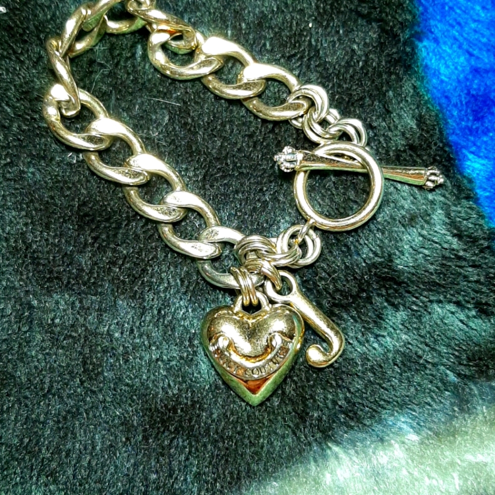 Gold tone Juicy Couture charm bracelet
